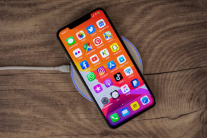 Apple iPhone 11 Pro Max lies on charging pad, wireless charging, Apple iPhone 11 Pro Max lies on charging pad, wireless charging,